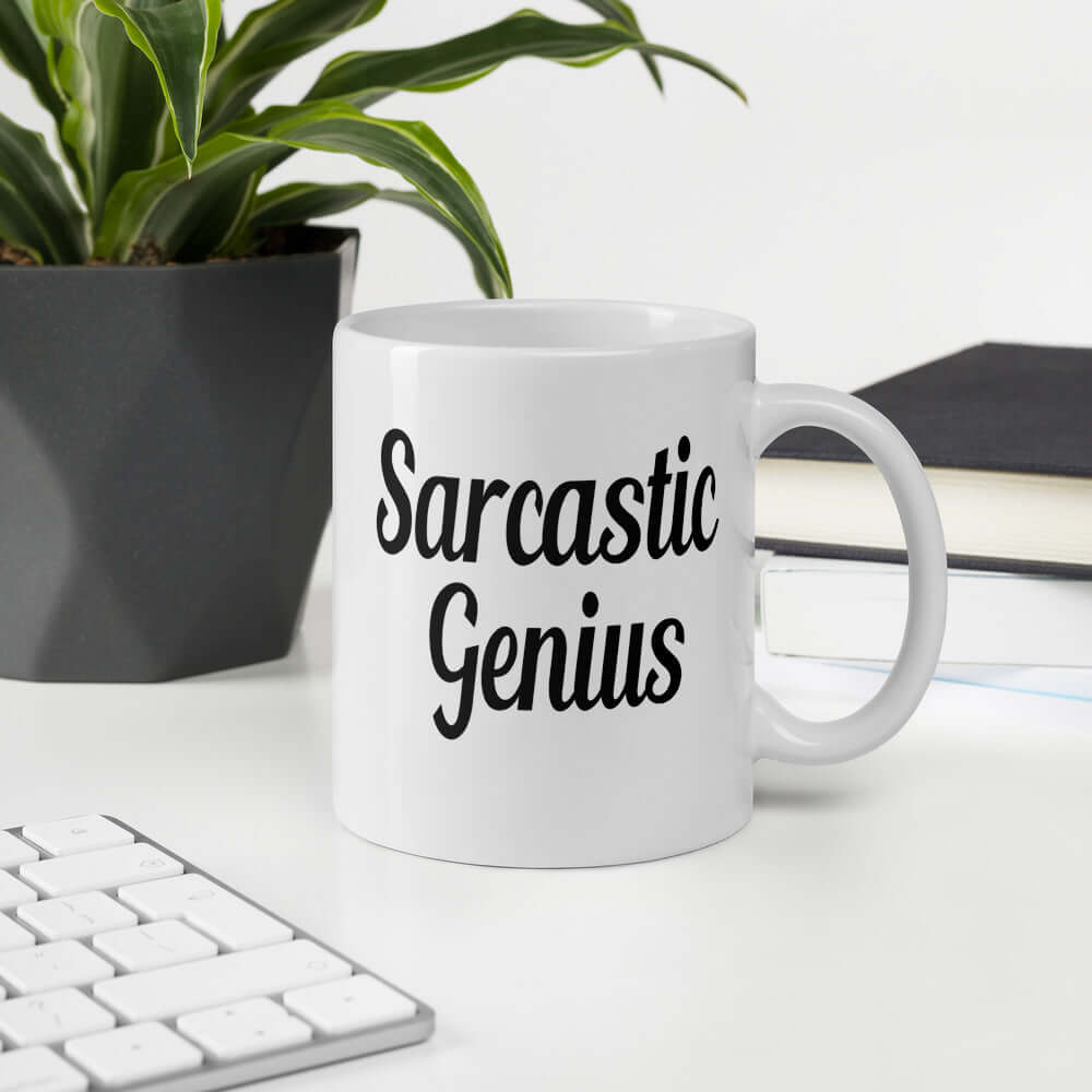 White ceramic coffee mug with the words Sarcastic Genius printed on both sides of the mug.