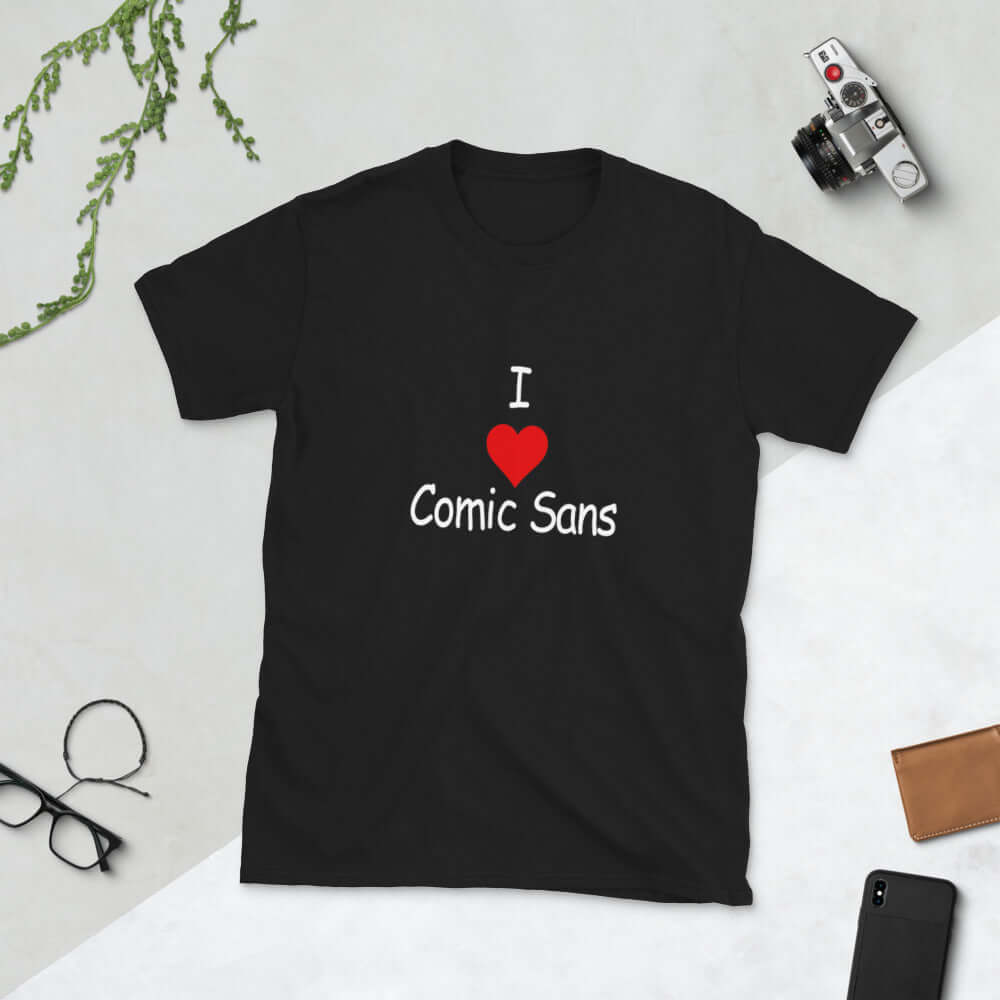 Black t-shirt with the phrase I heart Comic Sans on the front. The text is in comic sans font.