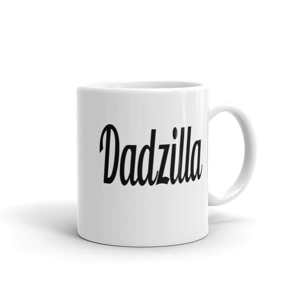 White ceramic coffee mug with the word Dadzilla printed on both sides of the mug.