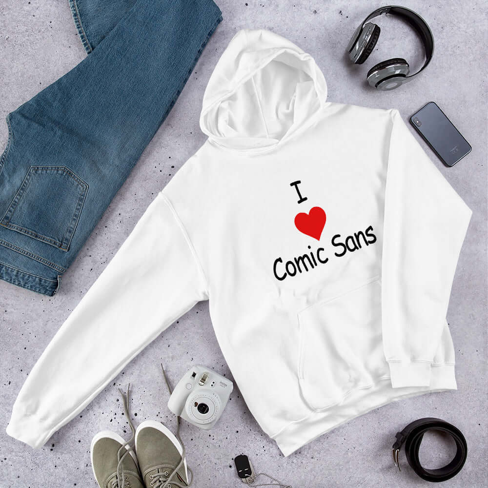 White hoodie sweatshirt with the phrase I heart Comic Sans on the front. The text is in comic sans font.