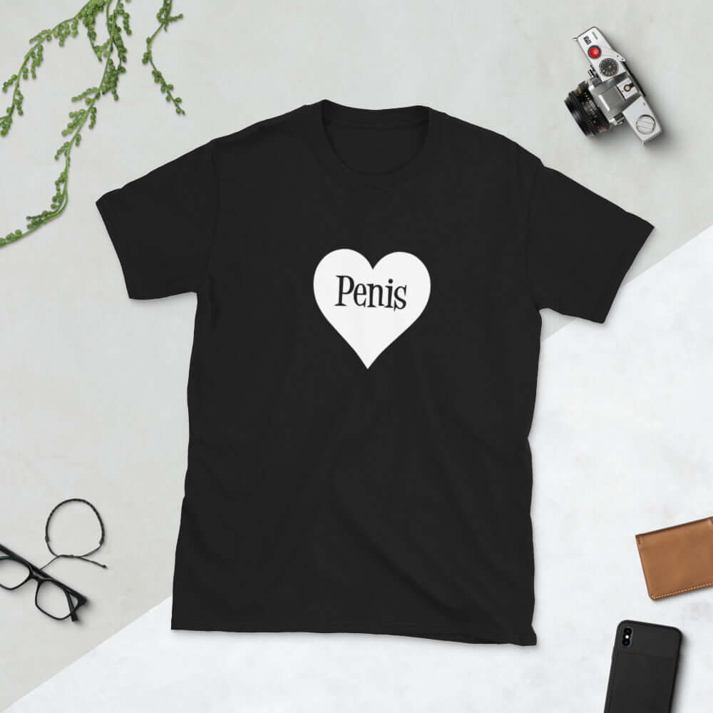 Black t-shirt with a heart image printed on the front. The word penis is inside the heart