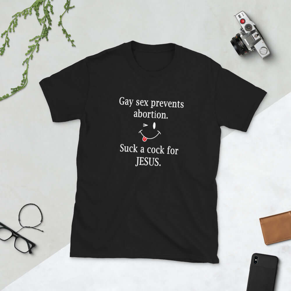 Black t-shirt with the phrase Gay sex prevents abortion. Suck a cock for Jesus printed on the front.