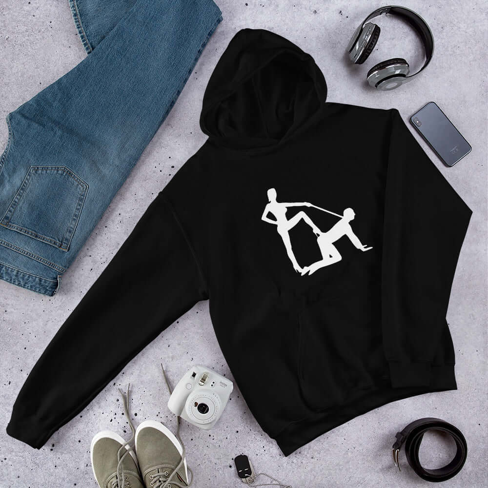 Black hooded sweatshirt with silhouette image of a man on his hands and knees and a dominatrix holding his leash printed on the front.