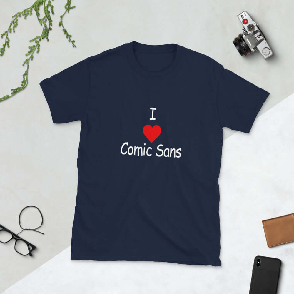 Navy blue t-shirt with the phrase I heart Comic Sans on the front. The text is in comic sans font.