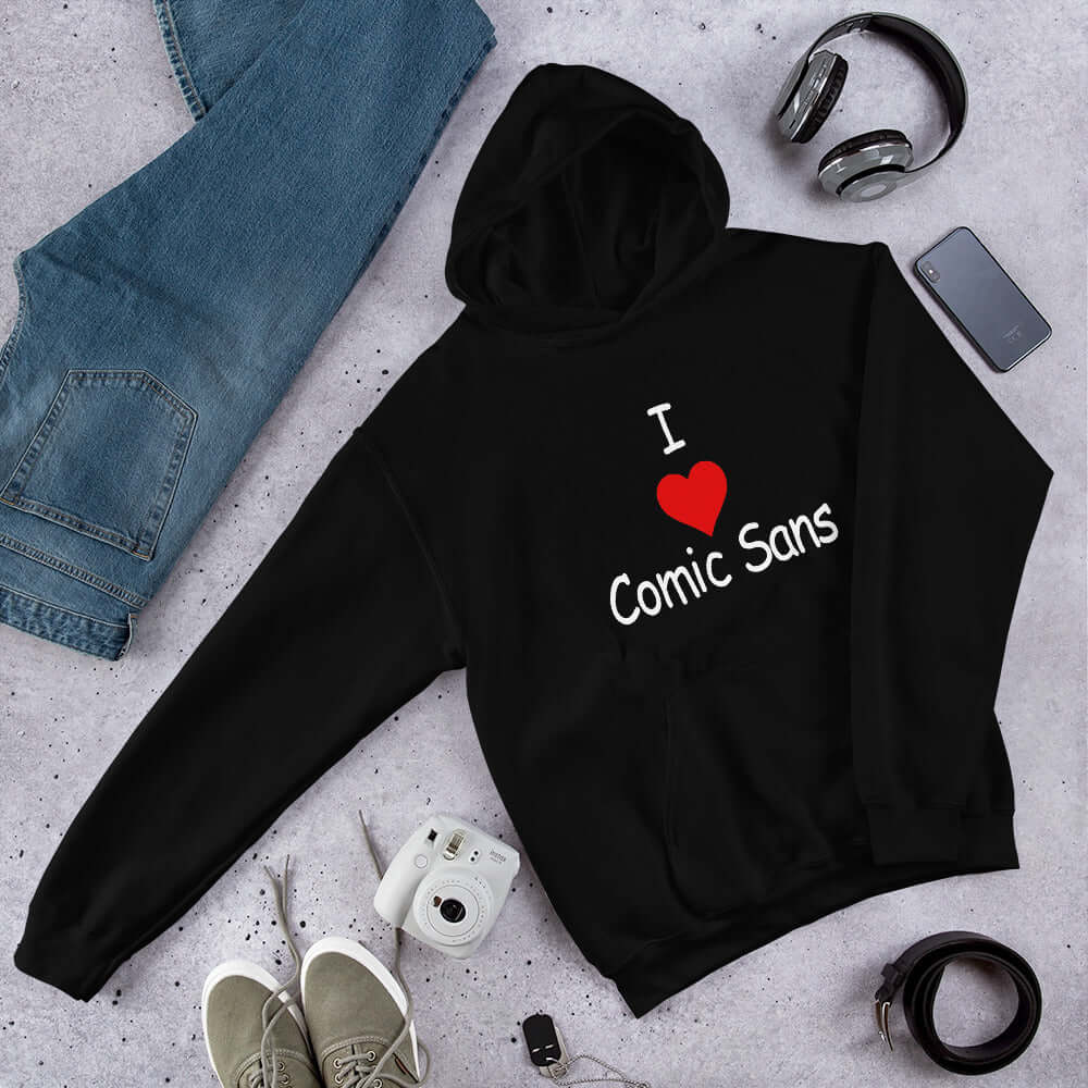 Black hoodie sweatshirt with the phrase I heart Comic Sans on the front. The text is in comic sans font.