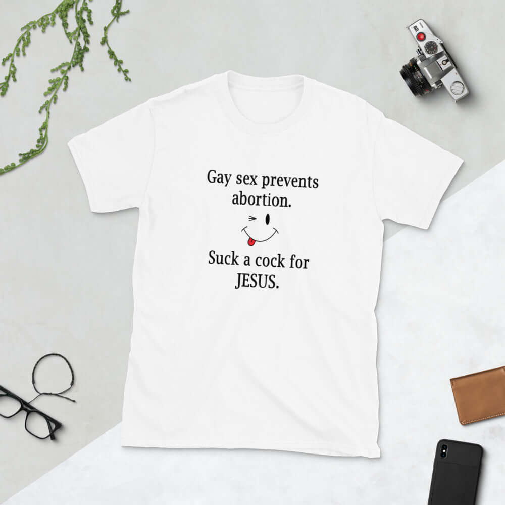 White t-shirt with the phrase Gay sex prevents abortion. Suck a cock for Jesus printed on the front.