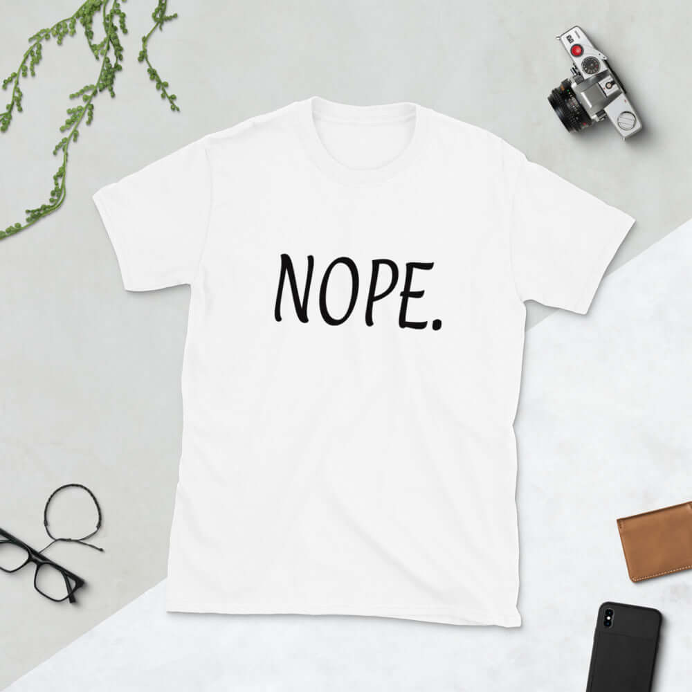 White t-shirt with the word Nope printed on the front.