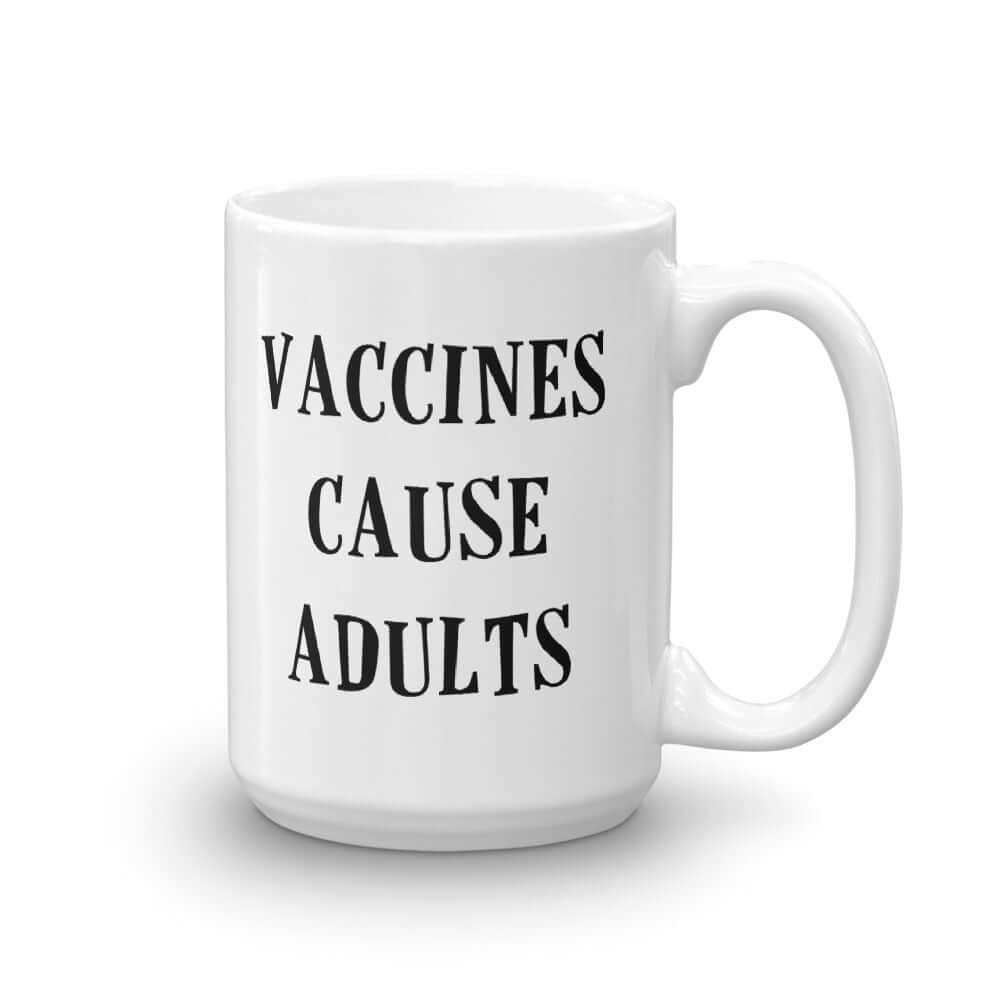 White ceramic mug with the words Vaccines cause adults printed on both sides.