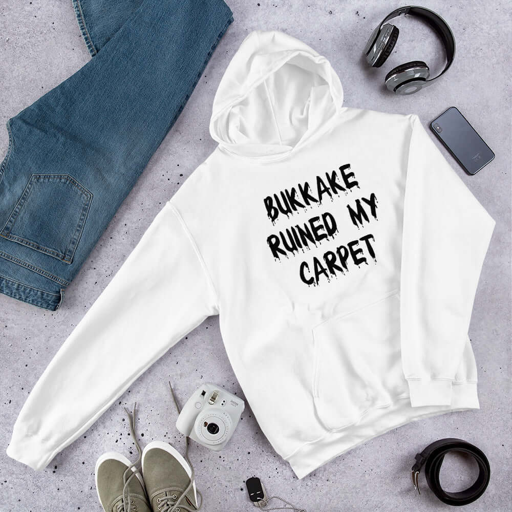 White hoodie with the words Bukkake ruined my carpet printed on the front.