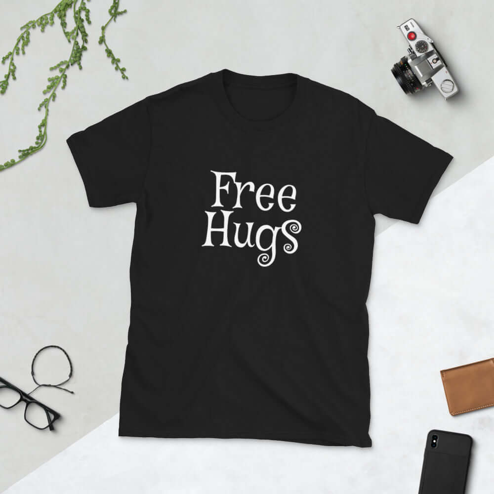 Black t-shirt with the words Free Hugs printed on the front.