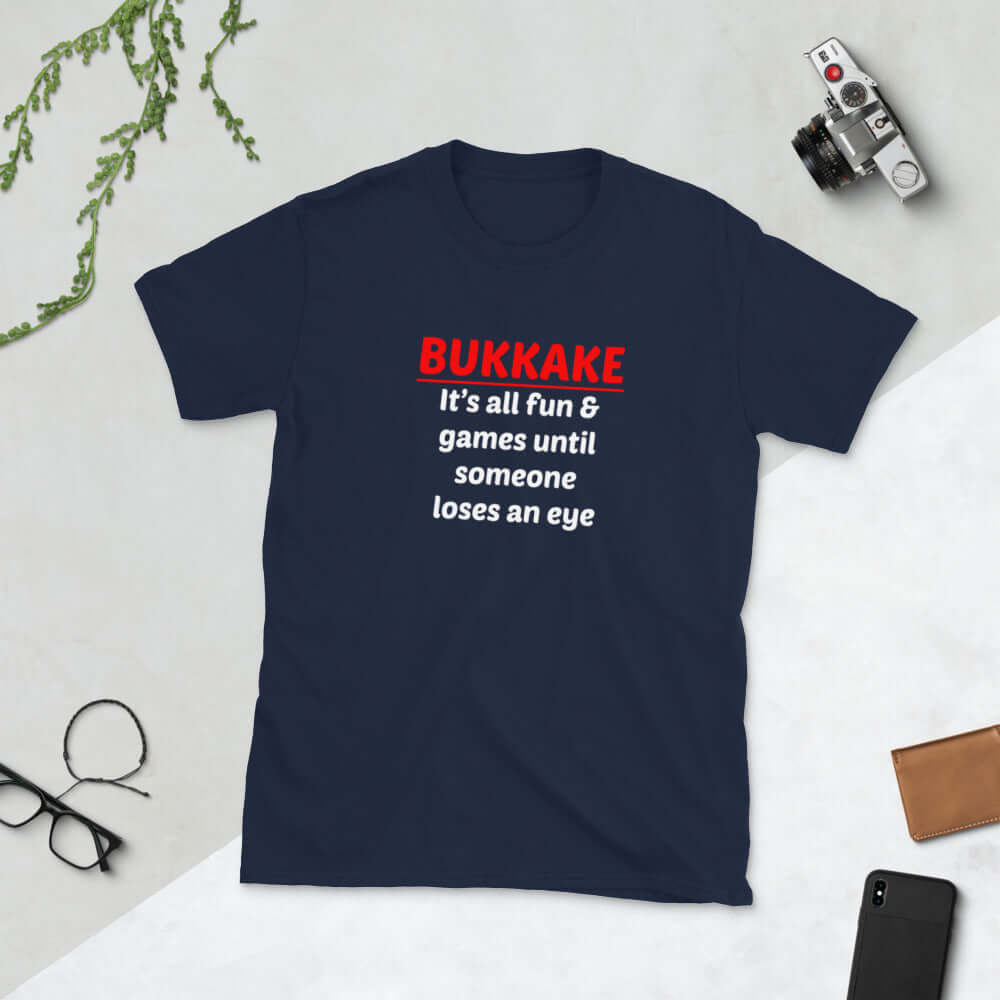 Navy blue t-shirt with the words Bukkake it's all fun & games until someone loses an eye printed on the front.