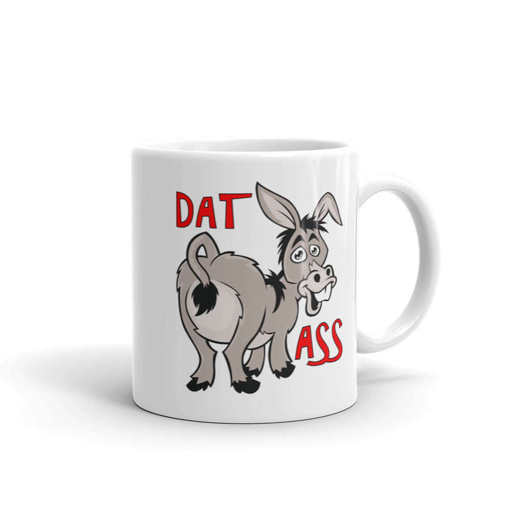 White ceramic coffee mug with an image of a goofy donkey and the words Dat Ass printed on both sided of the mug.