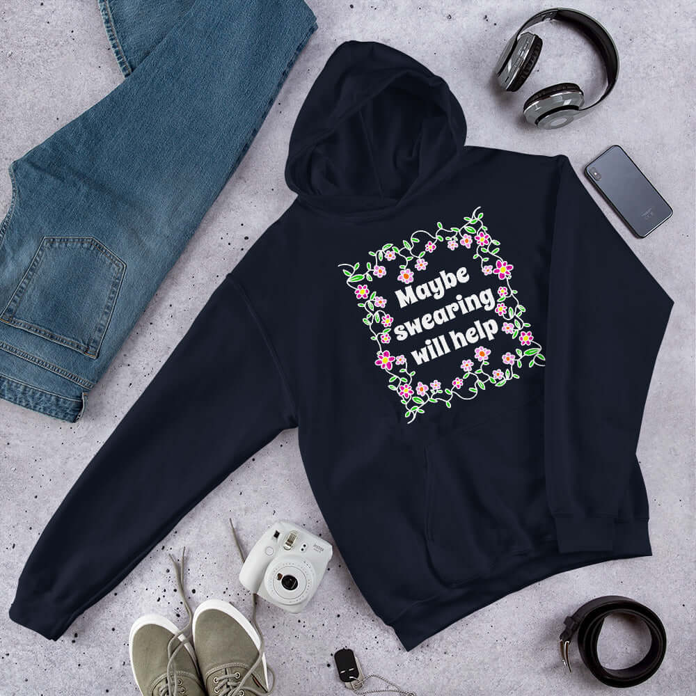 Navy blue hoodie sweatshirt with a floral graphic and the phrase Maybe swearing will help printed on the front.