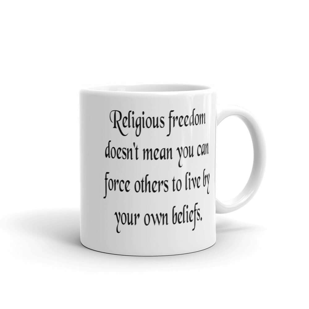 White ceramic coffee mug with the phrase Religious freedom doesn't mean you can force others to live by your own beliefs printed on both sides of the mug.