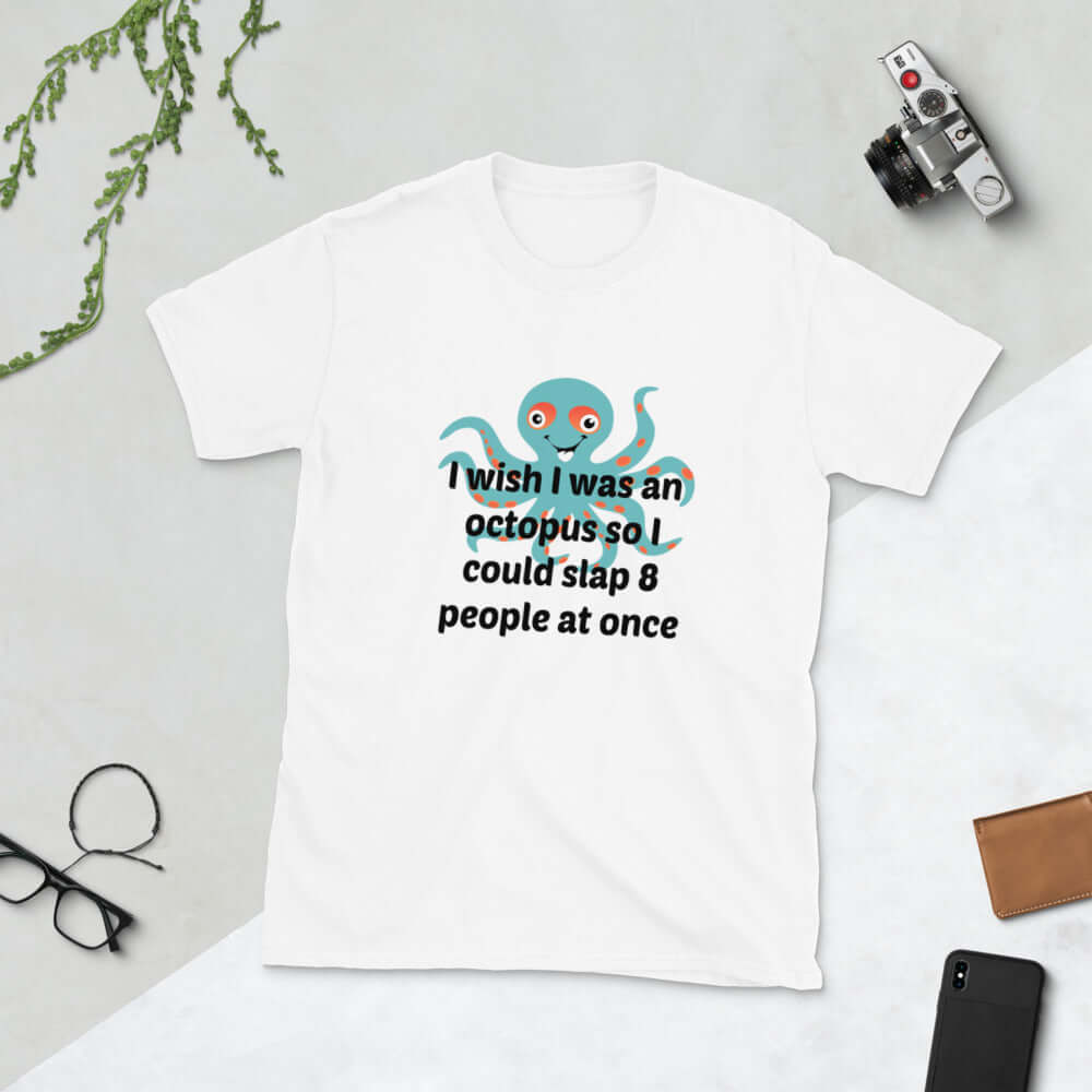 White Woman wearing a black t-shirt with an image of an octopus and the phrase I wish I was an octopus so I could slap 8 people at once printed on the front of the shirt.
