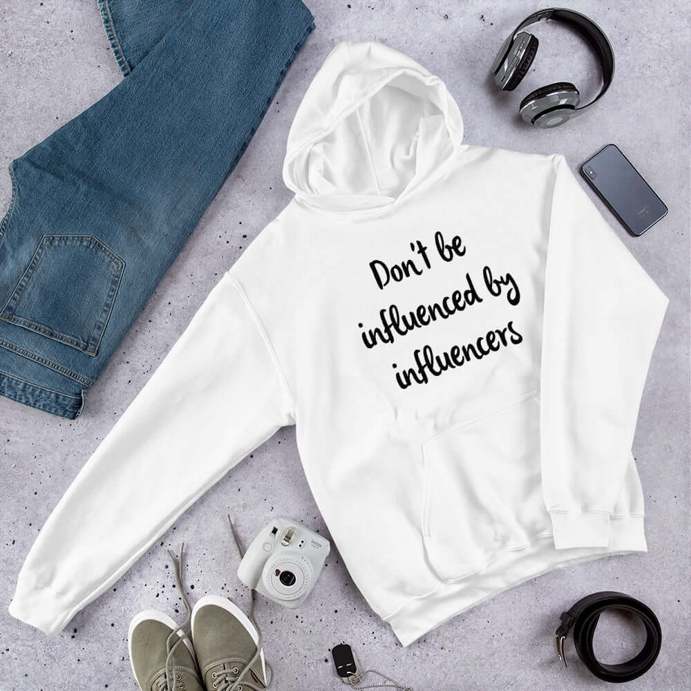 White hoodie sweatshirt with the phrase Don't be influenced by influencers printed on the front.