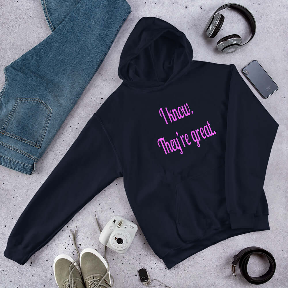 Navy blue hoodie sweatshirt with the phrase I know, they're great printed in hot pink letters on the front of the hoodie.