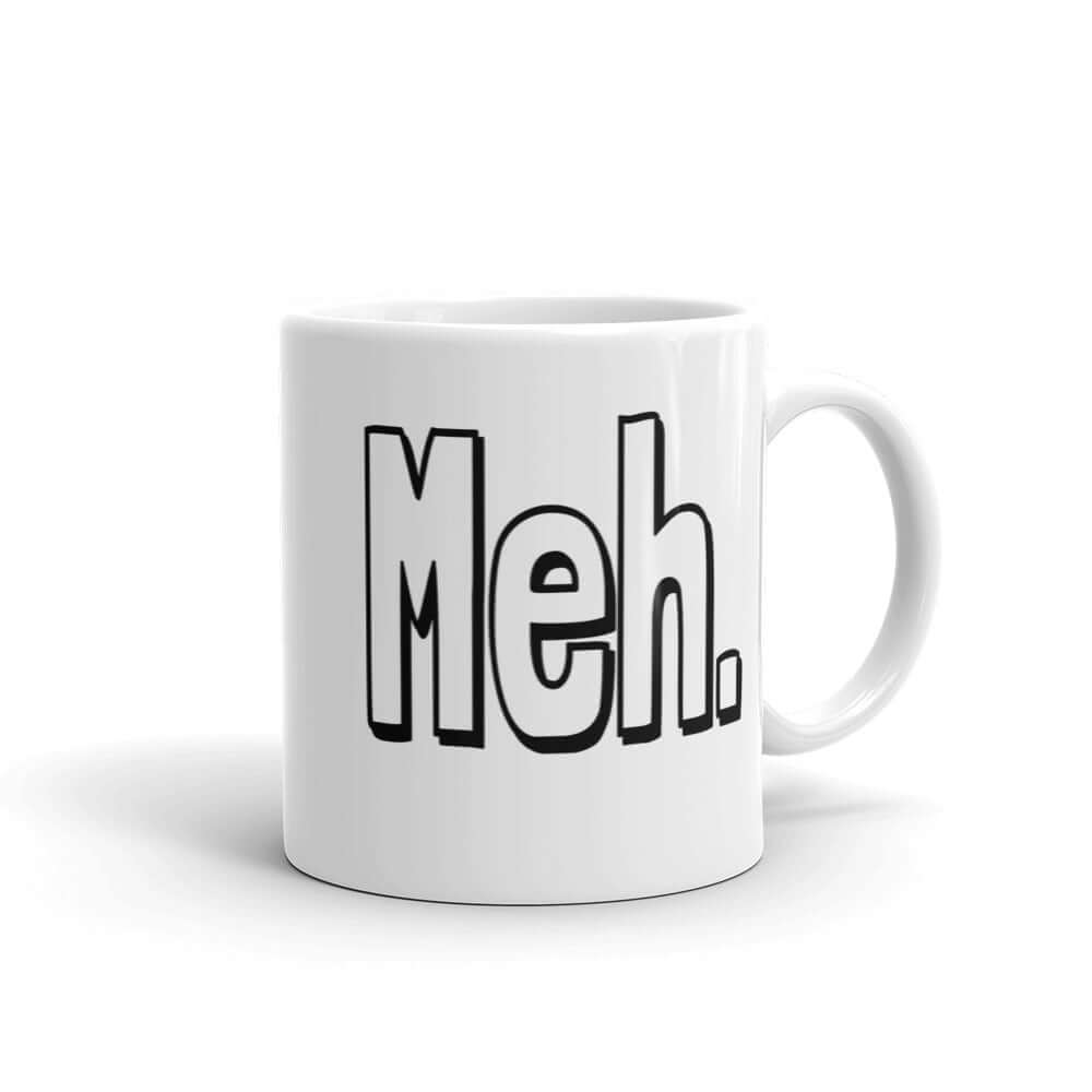 White ceramic coffee mug with the word Meh printed on both sides.