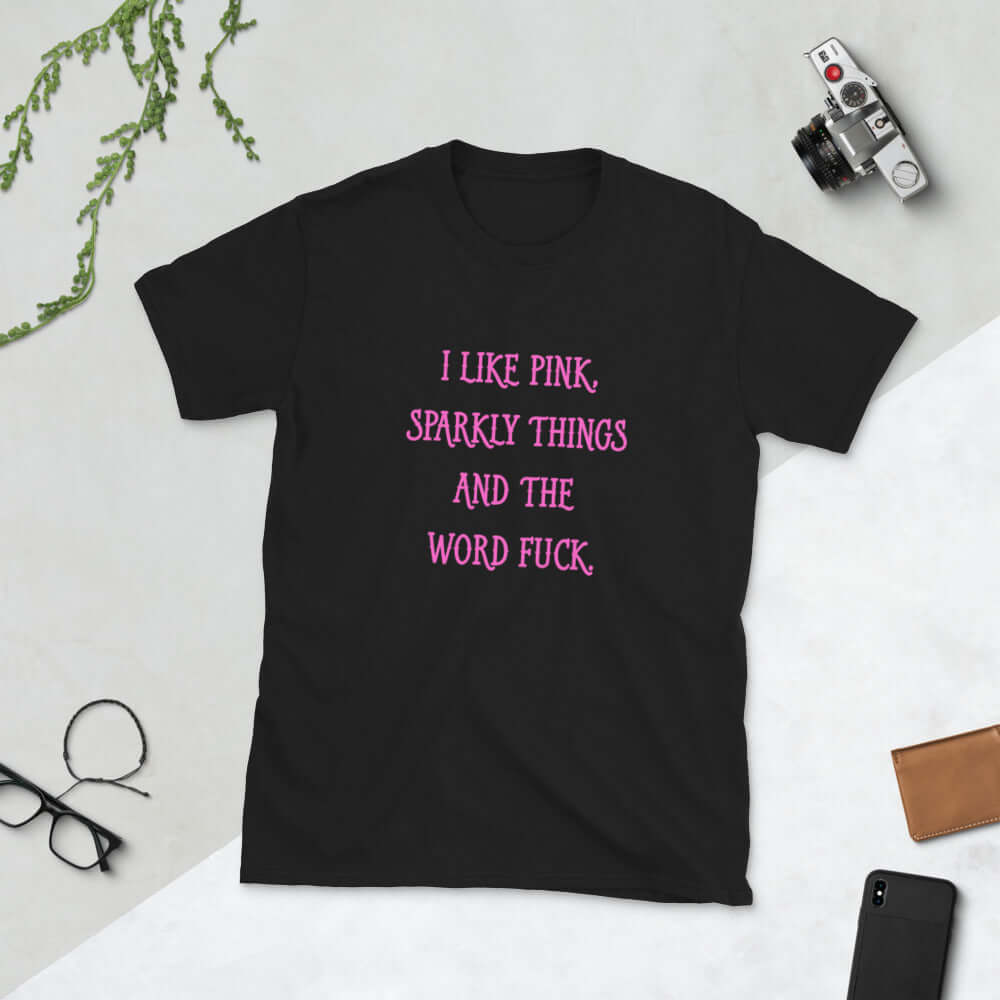 Black t-shirt with the phrase I like pink, sparkly things and the word fuck printed in pink on the front of the shirt.