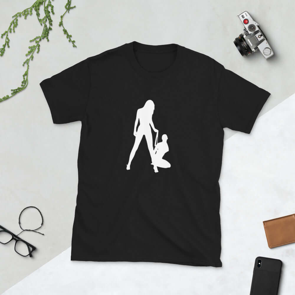 Black t-shirt with a silhouette image of 2 women in a lesbian BDSM scene. 1 woman is on her knees and the other has her on a leash. The graphic is printed on the front of the shirt.