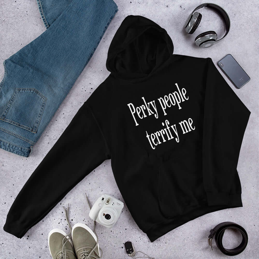 Black hoodie sweatshirt with the phrase Perky people terrify me printed on the front.