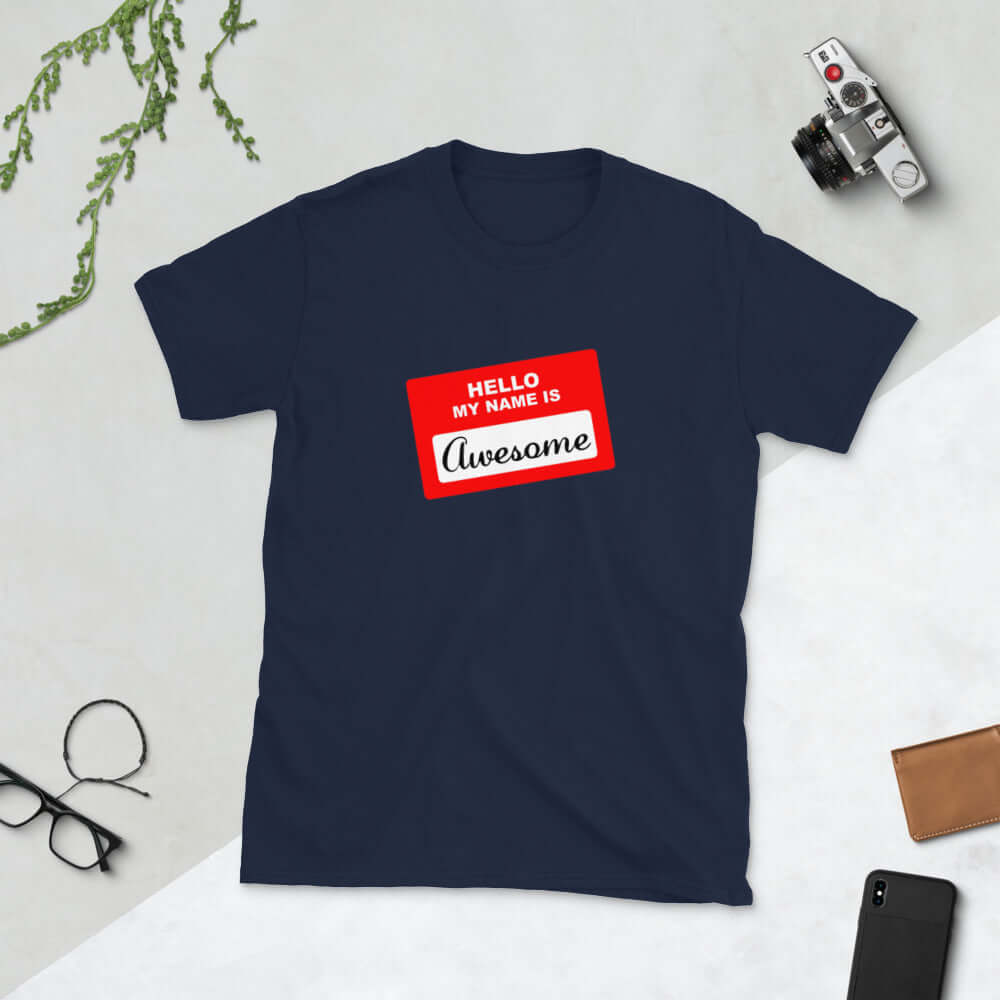 Navy t-shirt with an image of a classic red and white sticker name tag that says Hello my name is Awesome printed on the front.
