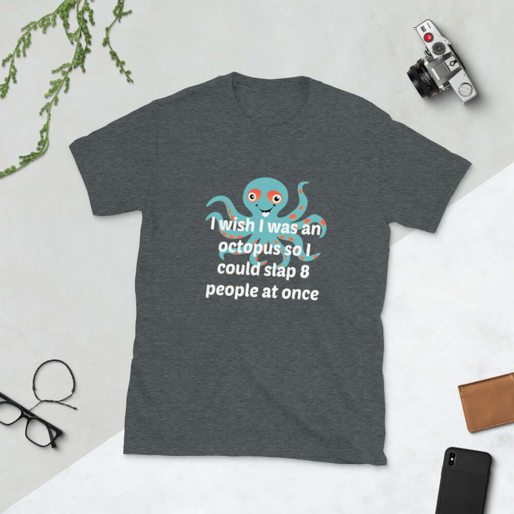 Dark heather grey Woman wearing a black t-shirt with an image of an octopus and the phrase I wish I was an octopus so I could slap 8 people at once printed on the front of the shirt.