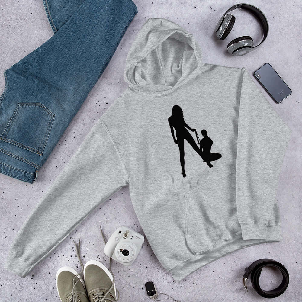 Light sport grey hoodie sweatshirt with a silhouette image of 2 women in a lesbian BDSM scene. 1 woman is on her knees and the other has her on a leash. The graphic is printed on the front of the hoodie.