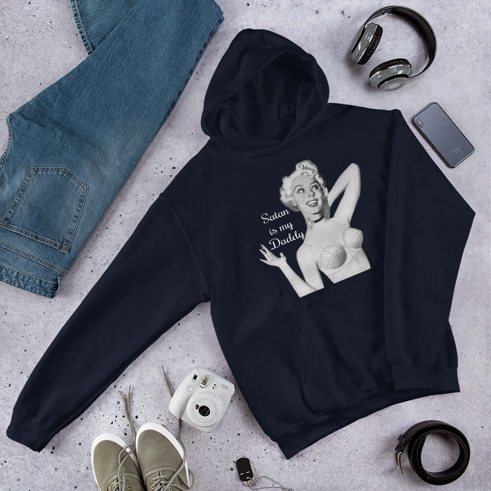 Navy blue hoodie sweatshirt with image of a retro black & white pin-up model and the phrase Satan is my Daddy printed on the front.