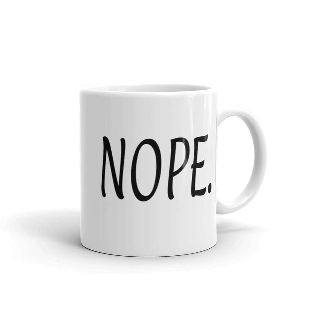 White ceramic coffee mug with the word Nope printed on both sides.