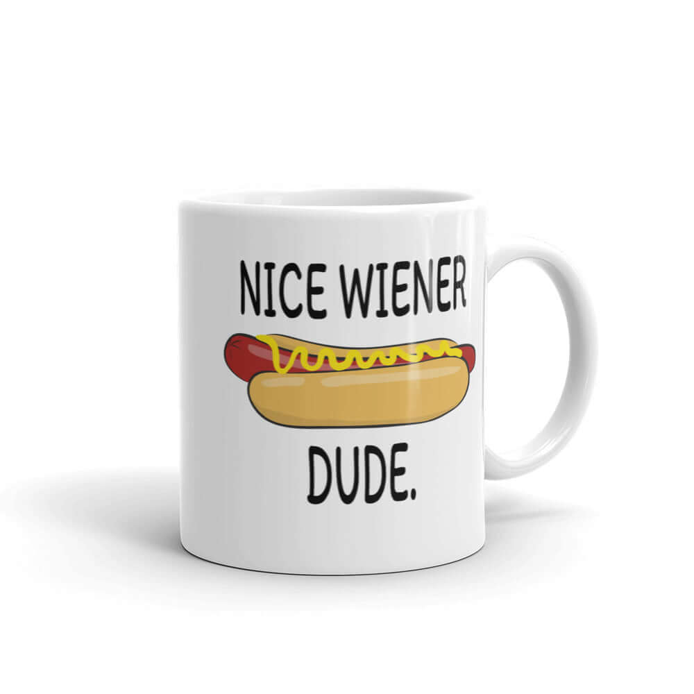 White ceramic mug with with an image of a hotdog and the phrase Nice wiener dude printed on both sides of the mug.