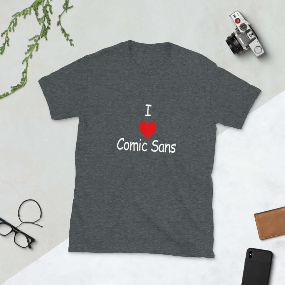 Dark heather grey t-shirt with the phrase I heart Comic Sans on the front. The text is in comic sans font.