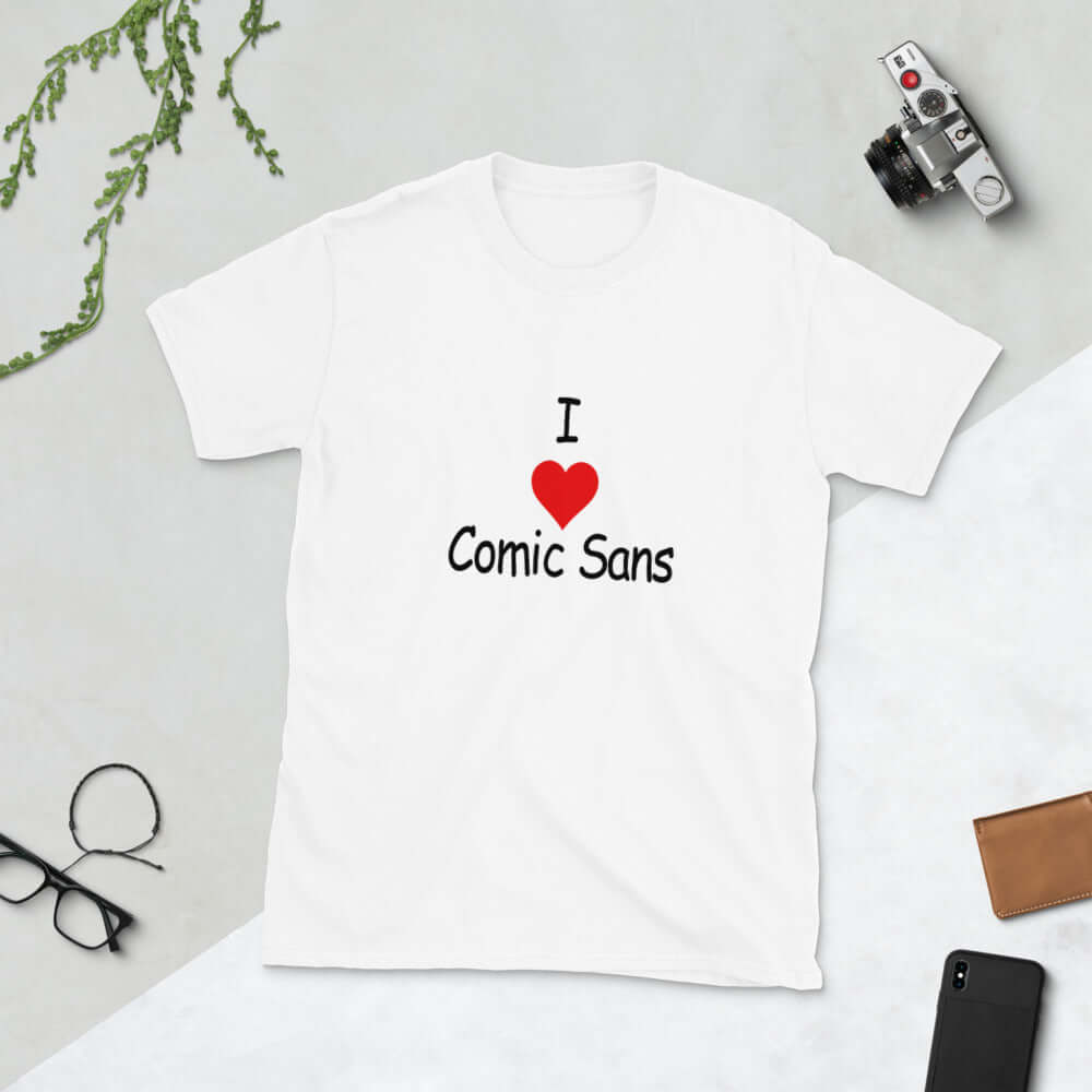 White t-shirt with the phrase I heart Comic Sans on the front. The text is in comic sans font.