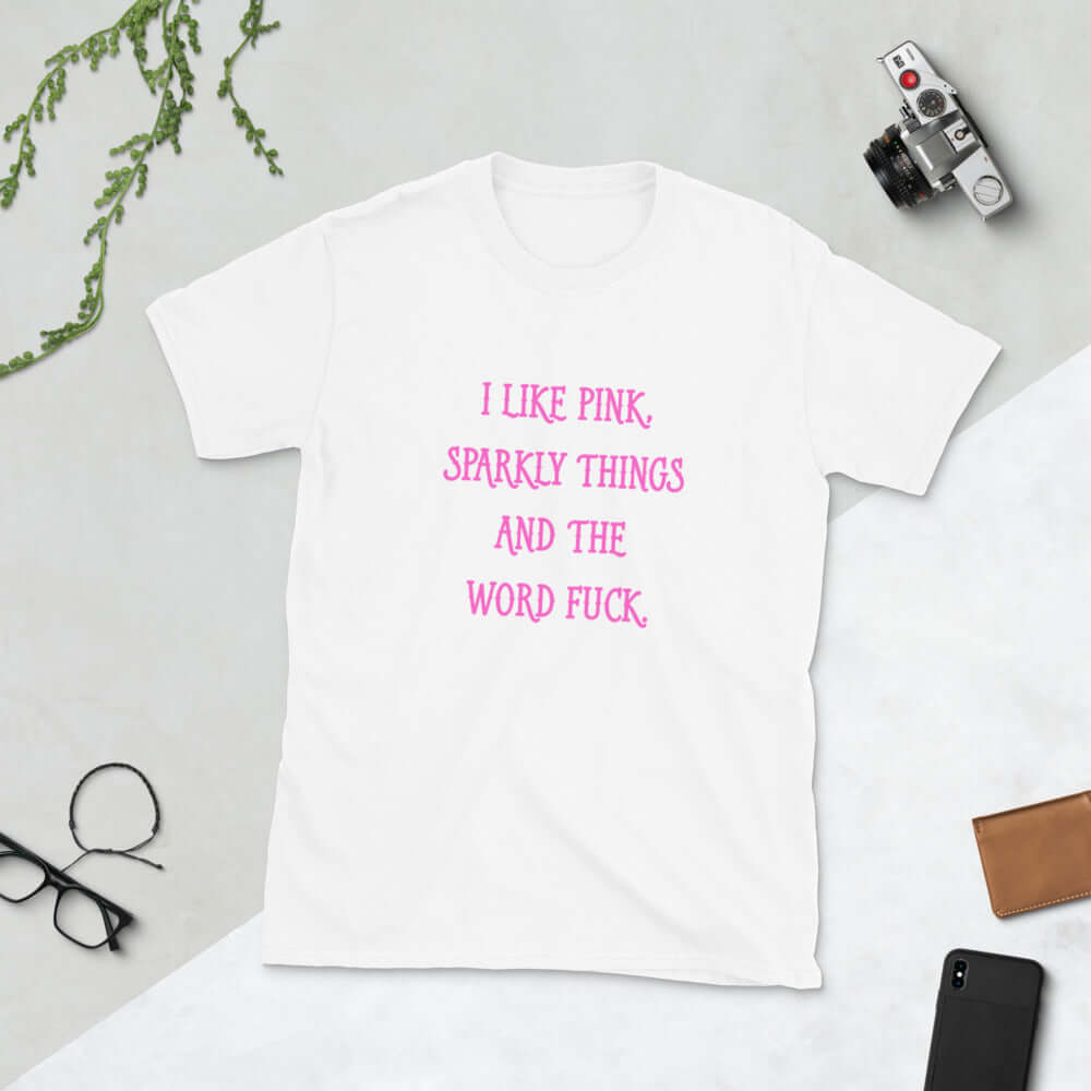 White t-shirt with the phrase I like pink, sparkly things and the word fuck printed in pink on the front of the shirt.