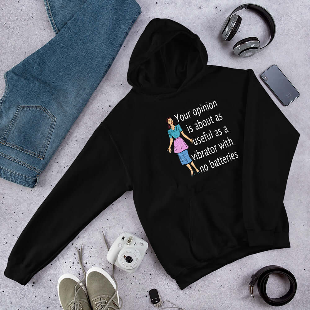 Black hoodie sweatshirt with an image of a retro woman and the phrase Your opinion is about as useful as a vibrator with no batteries printed on the front.