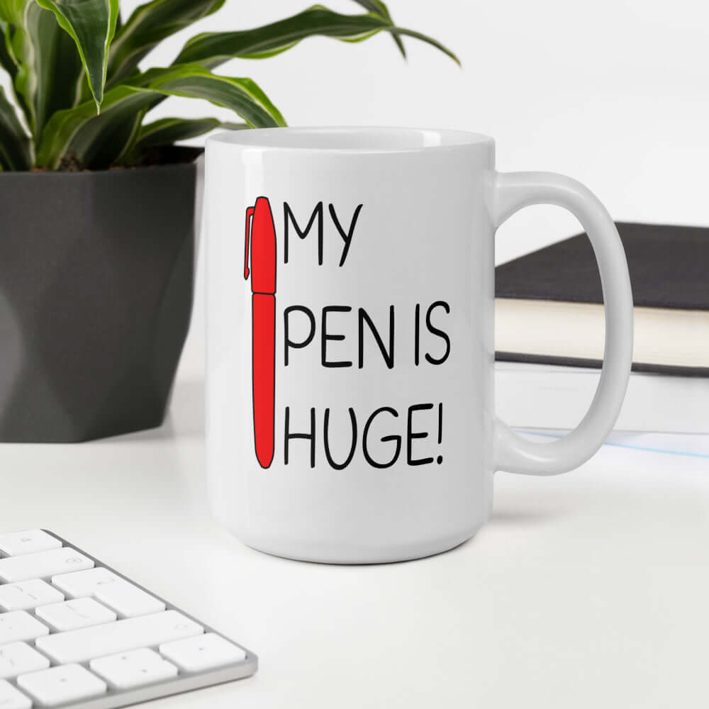 White ceramic mug with an image of a big red pen and the words My pen is huge printed on both sides. The words Pen and is are close together so that at first glance it appears that it says penis instead of pen is.