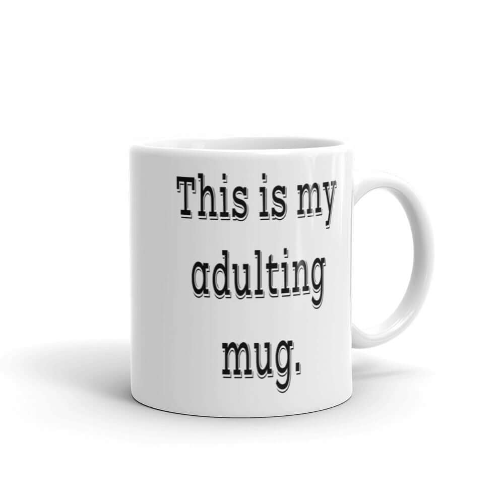 White ceramic coffee mug with the phrase This is my adulting mug printed on both sides of the mug.