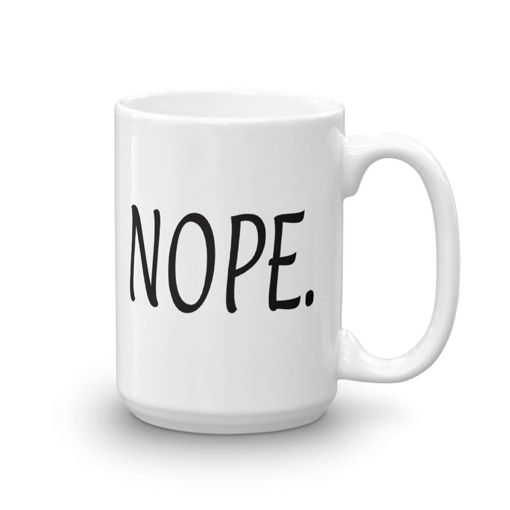 White ceramic coffee mug with the word Nope printed on both sides.