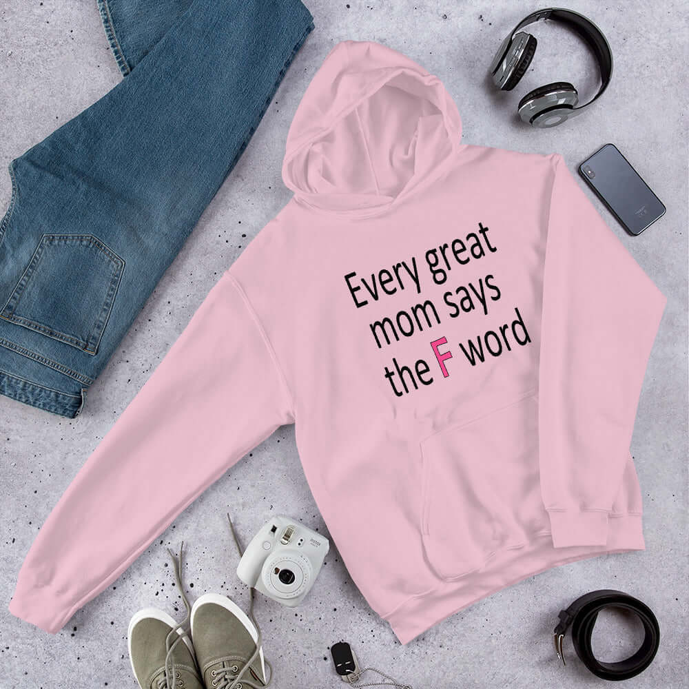 Light pink hoodie sweatshirt that has the phrase Every great Mom says the F word printed on the front.
