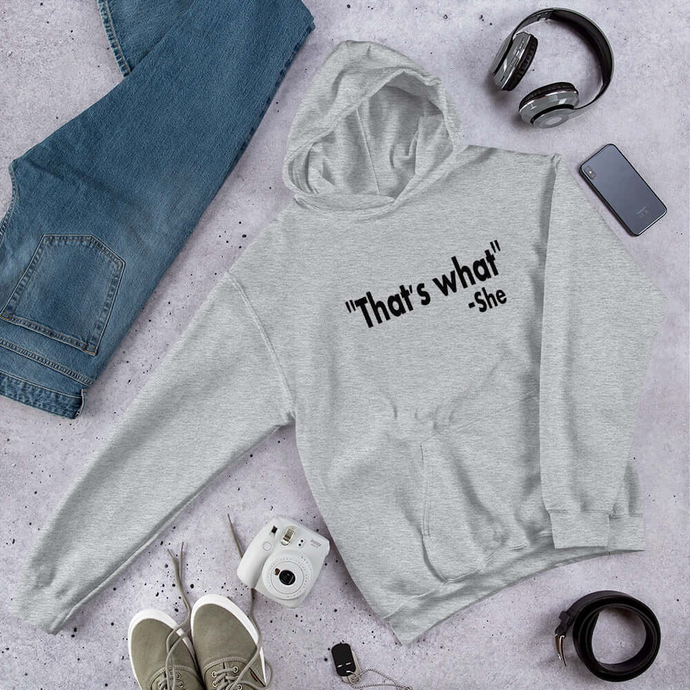 Light grey hoodie sweatshirt with the funny quote That's what-she printed on the front.