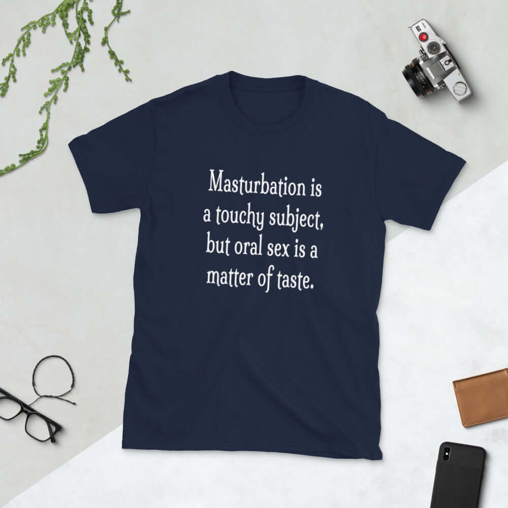 Navy blue t-shirt with the suggestive phrase Masturbation is a touchy subject, but oral sex is a matter of taste printed on the front.