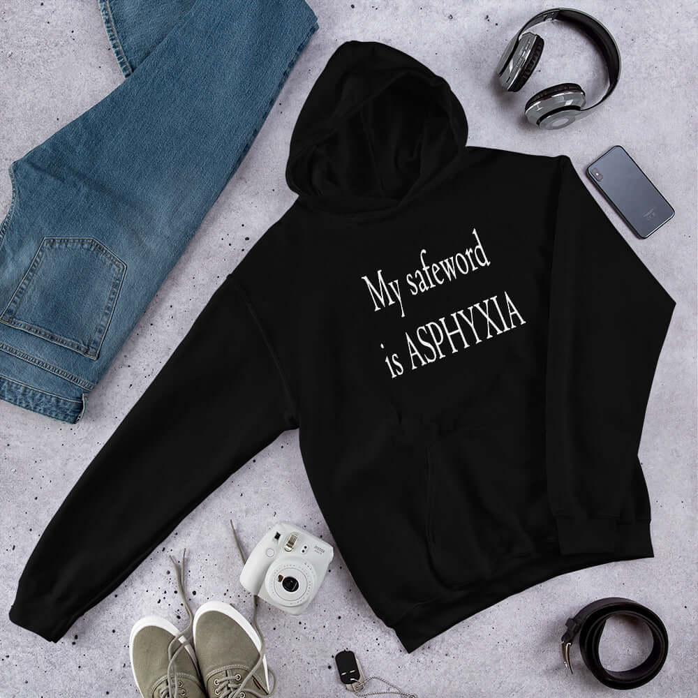 Black hoodie sweatshirt with the phrase My safeword is asphyxia printed on the front.