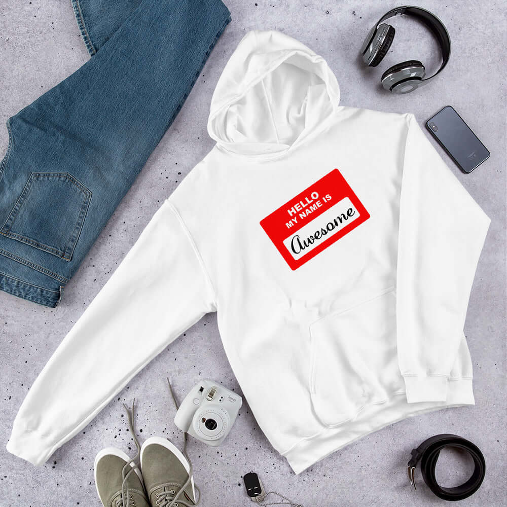 White hoodie sweatshirt with an image of a classic red and white sticker name tag that says Hello my name is Awesome printed on the front.