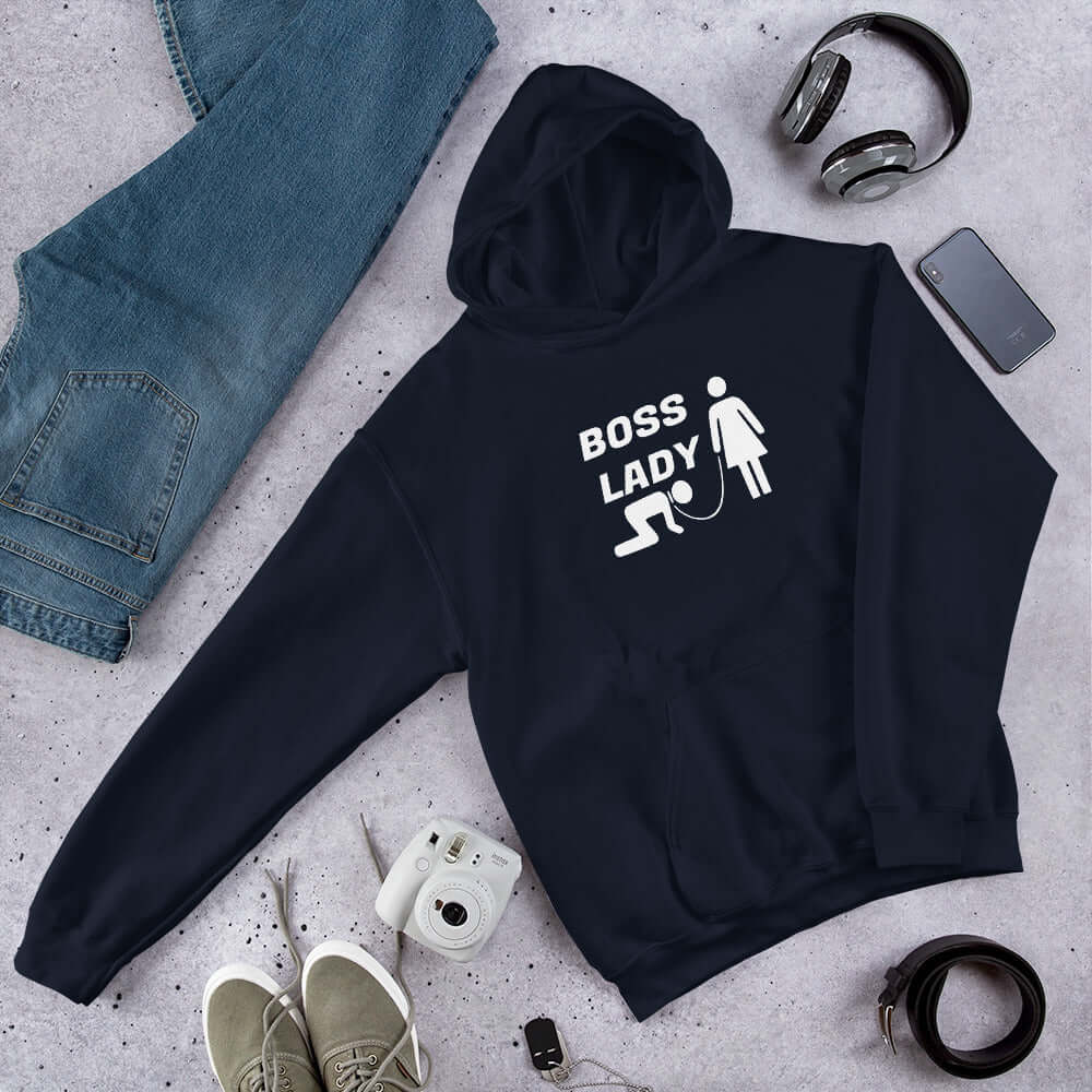 Navy blue hoodie sweatshirt with graphic of collared and leashed man on his hands and knees being led by a woman and the words Boss lady printed on the front.