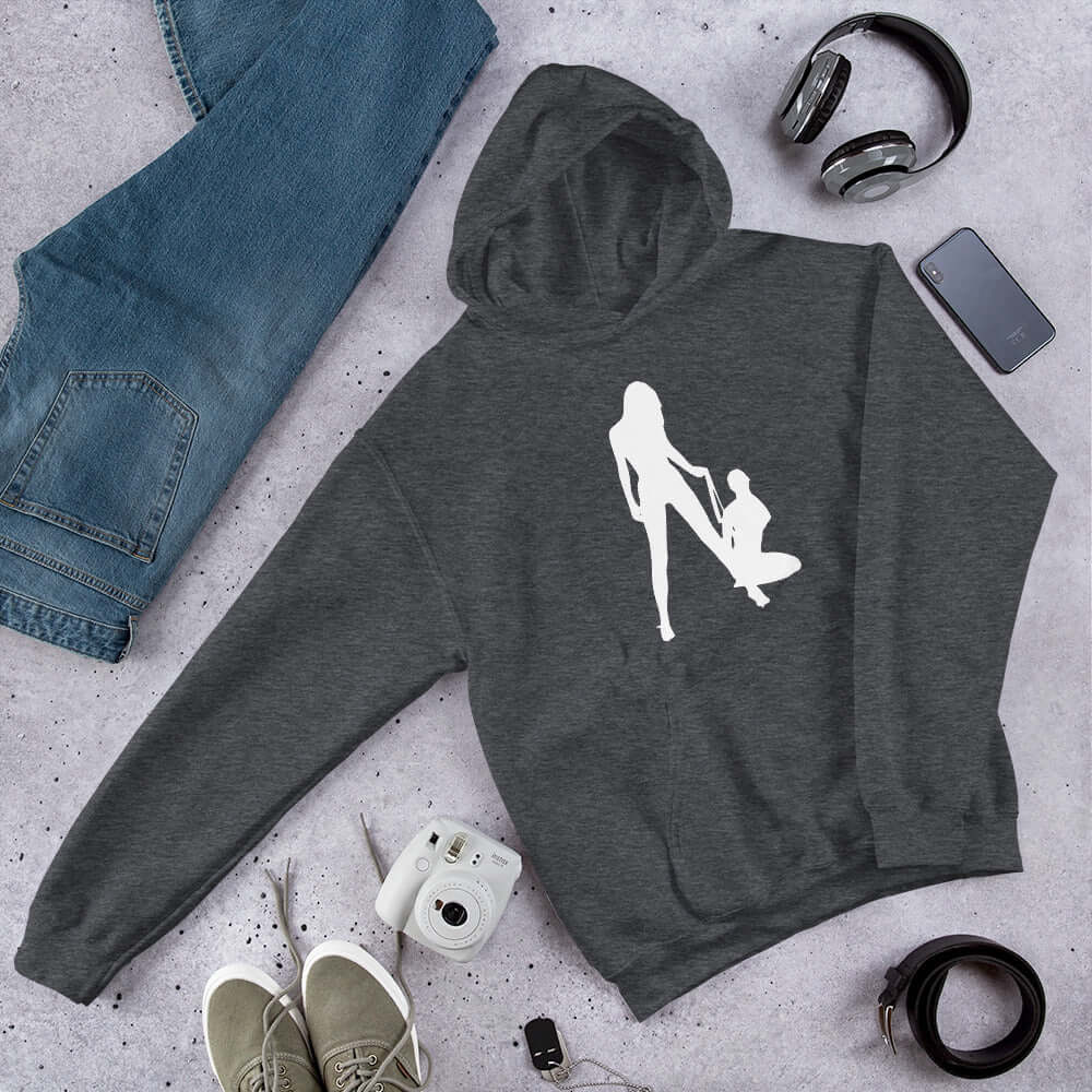 Dark heather grey hoodie sweatshirt with a silhouette image of 2 women in a lesbian BDSM scene. 1 woman is on her knees and the other has her on a leash. The graphic is printed on the front of the hoodie.