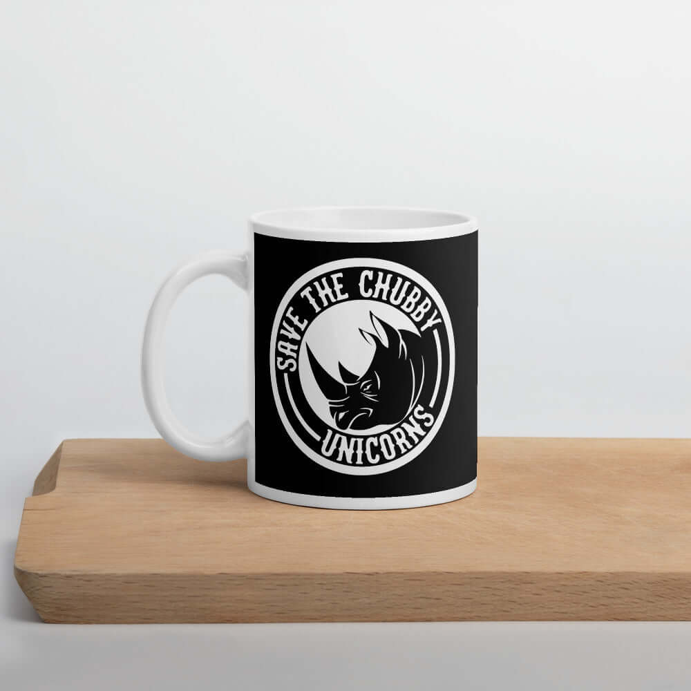 Black and white ceramic mug with a funny graphic of a rhinoceros & the words Save the chubby unicorns printed on both sides.