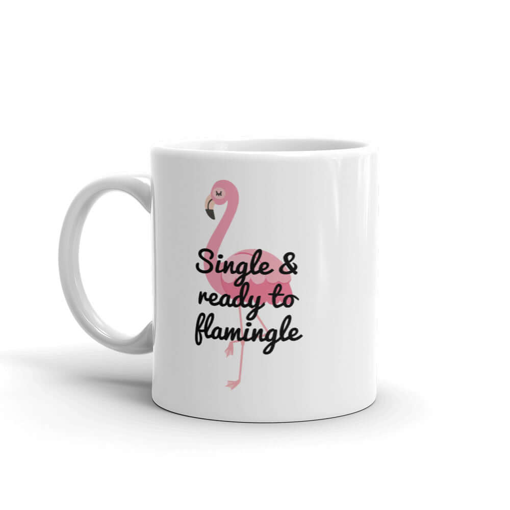 White ceramic coffee mug with image of a flamingo and the words Single and ready to flamingle printed on both sides.