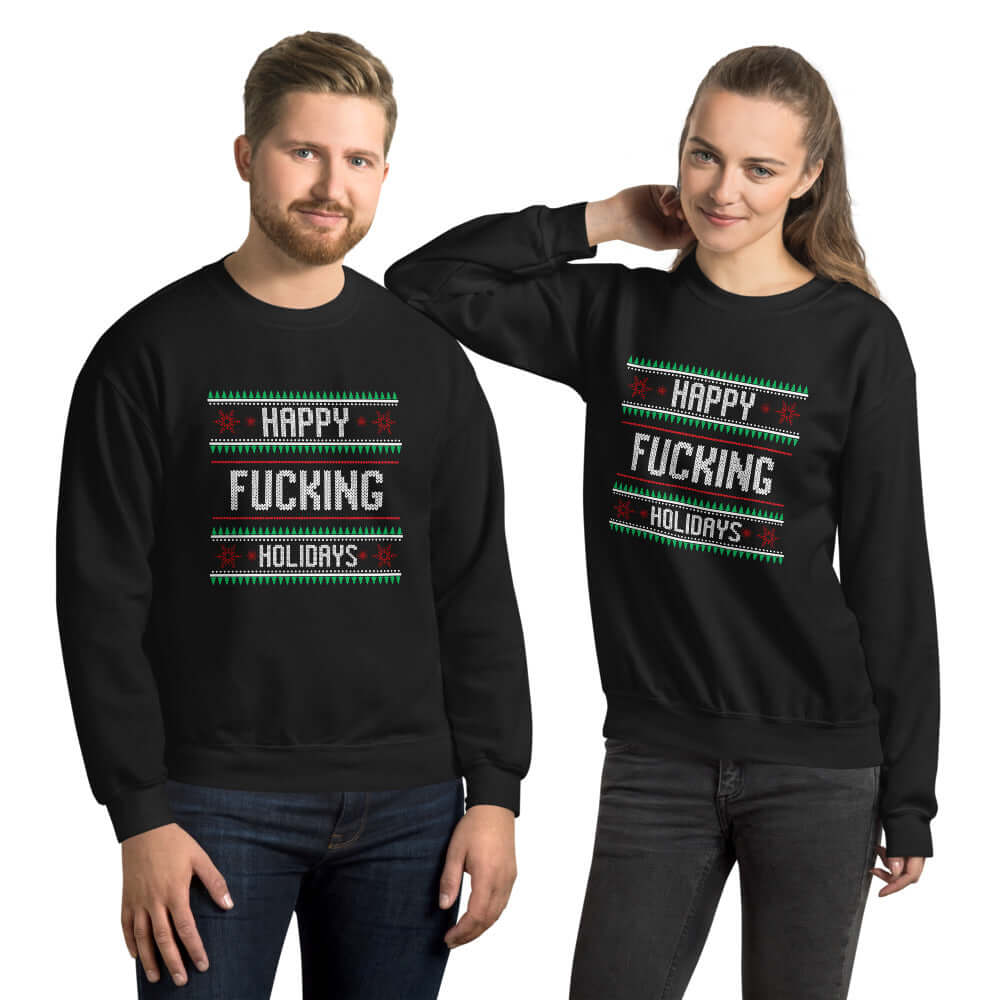 Man and woman standing next to each other while wearing black crewneck sweatshirt with the phrase Happy fucking holidays printed on the front. 