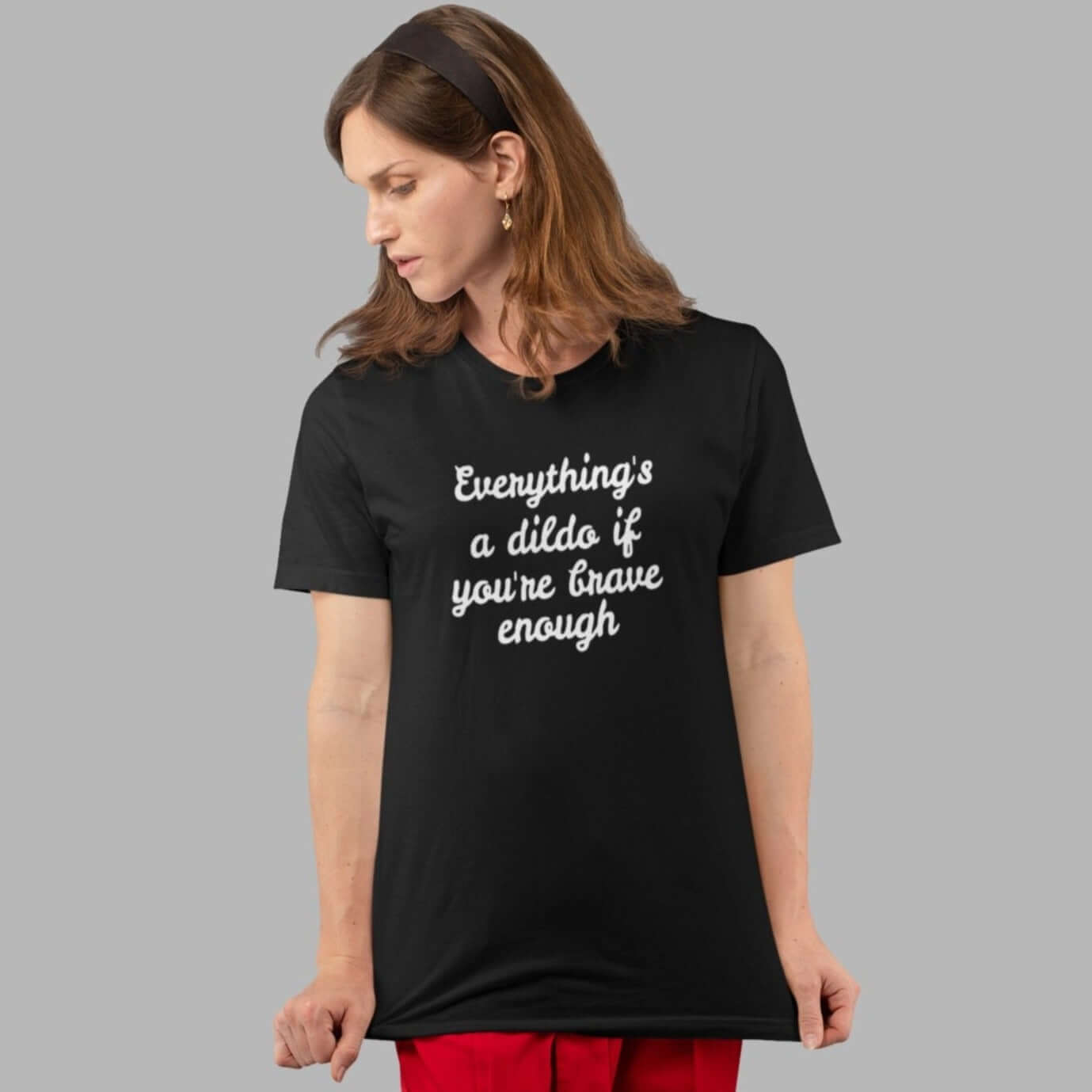 Woman wearing black t-shirt with the words Everything's a dildo if you're brave enough printed on the front.
