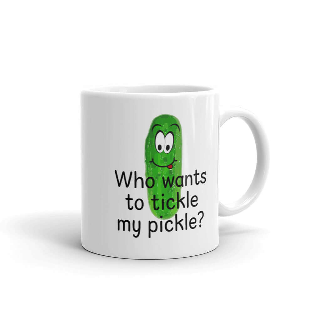 White ceramic coffee mug with an image of a pickle printed on both sides. The words Who wants to tickle my pickle are printed under the pickle.